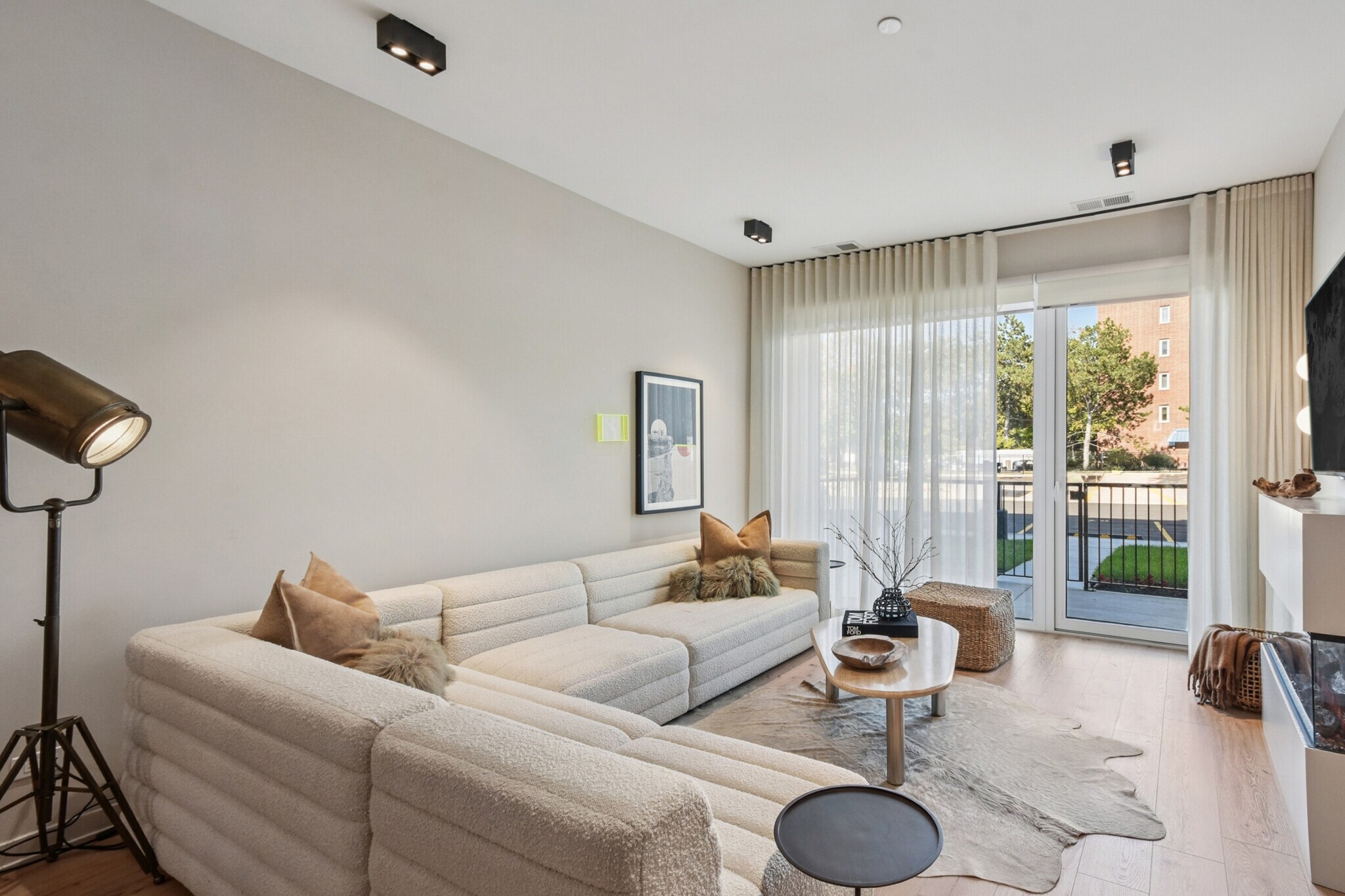 Living room with fireplace and balcony