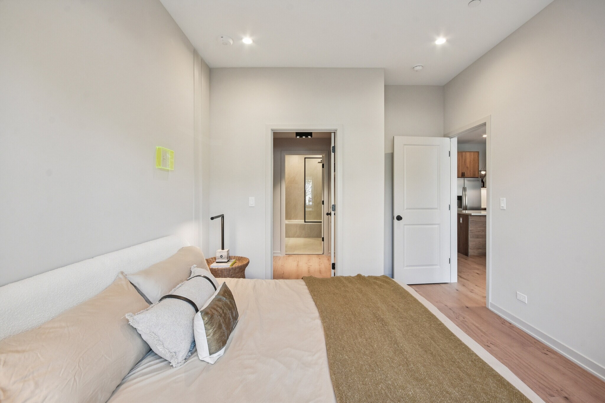 Bedroom with wide-plank flooring