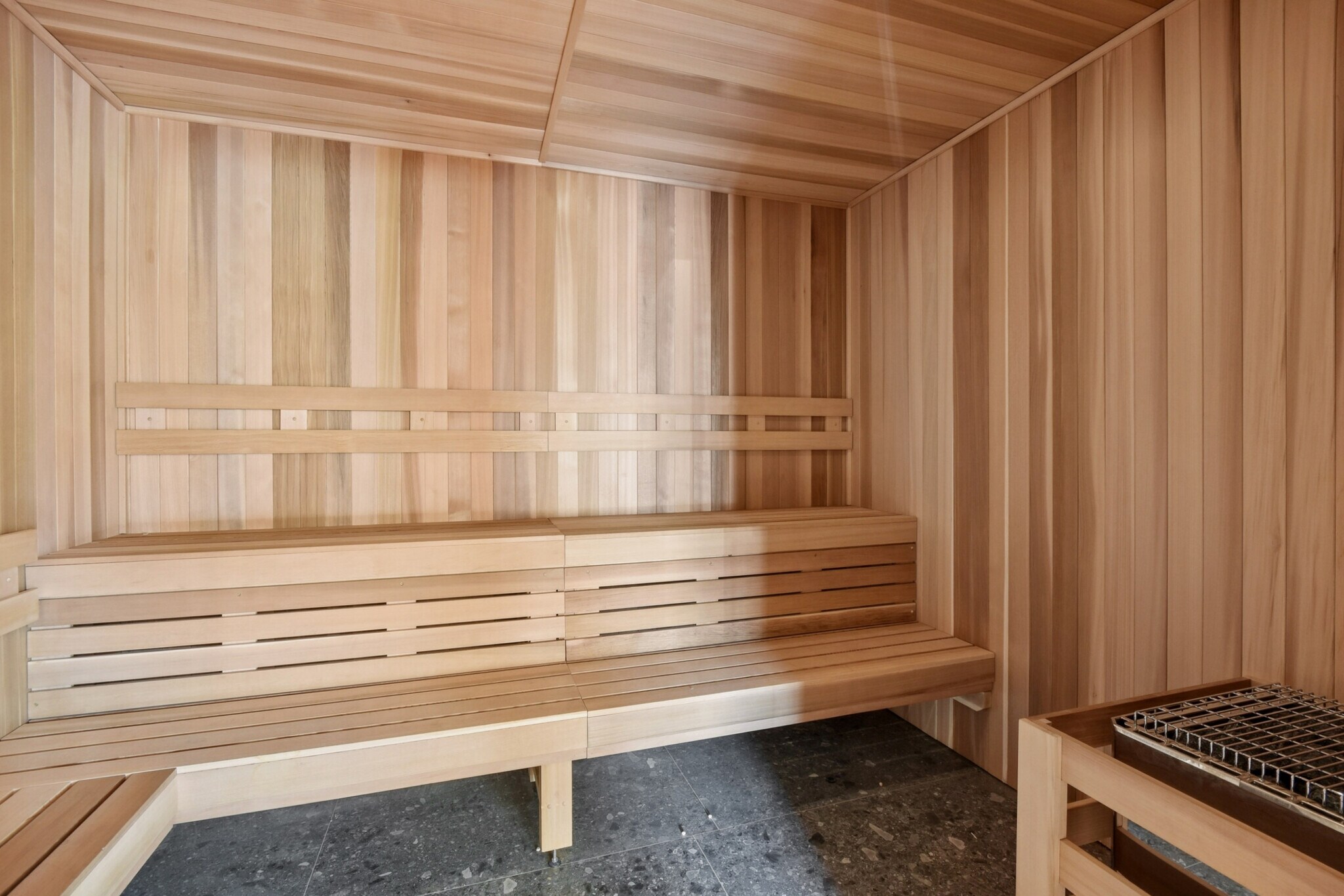 Wood-lined dry heat sauna at Novú